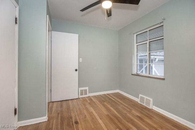 11202 Mountview Ave, Garfield Heights, OH 44125 - spare room featuring wood-type flooring and ceiling fan