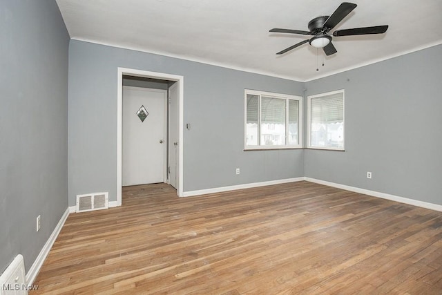 11202 Mountview Ave, Garfield Heights, OH 44125 - empty room with a ceiling fan and light wood-style floors