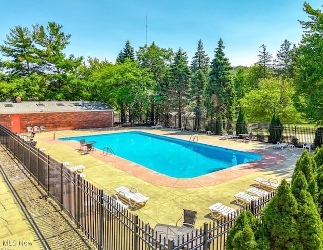 6466 Concord Dr Unit M1, Parma, OH 44134 - community pool with a patio and view of scattered trees