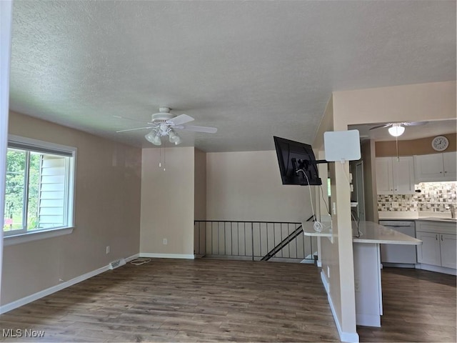 6466 Concord Dr Unit M1, Parma, OH 44134 - empty room with a ceiling fan, dark wood finished floors, and a textured ceiling