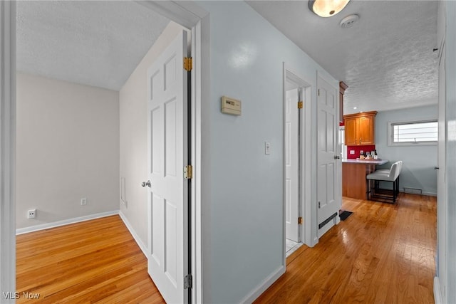 12610 Woodward Blvd, Garfield Heights, OH 44125 - hall featuring a textured ceiling and light wood-style flooring