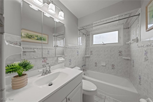 12610 Woodward Blvd, Garfield Heights, OH 44125 - full bath with tile walls, vanity, shower / tub combination, and tile patterned floors