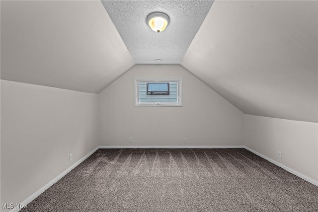 12610 Woodward Blvd, Garfield Heights, OH 44125 - additional living space with carpet floors and vaulted ceiling