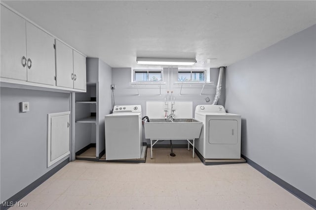 12610 Woodward Blvd, Garfield Heights, OH 44125 - laundry room with independent washer and dryer, cabinet space, and light floors