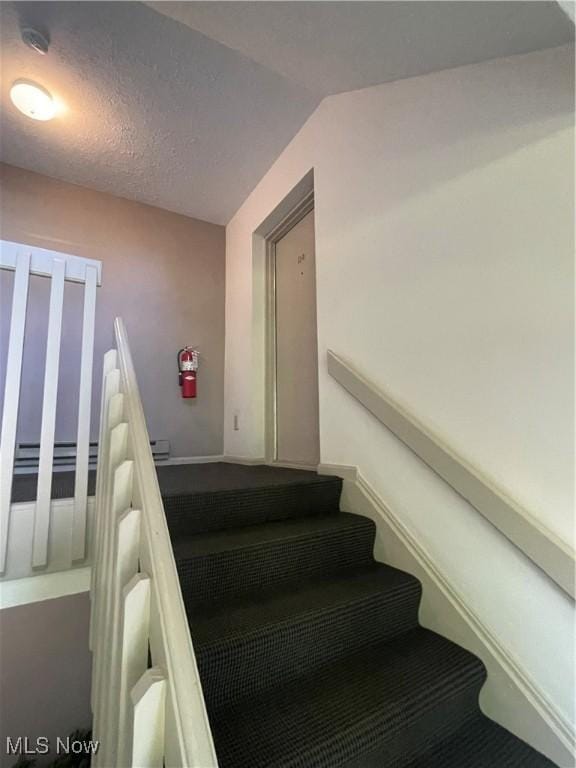 1304 Cedarwood Dr Unit D2, Westlake, OH 44145 - stairway with vaulted ceiling