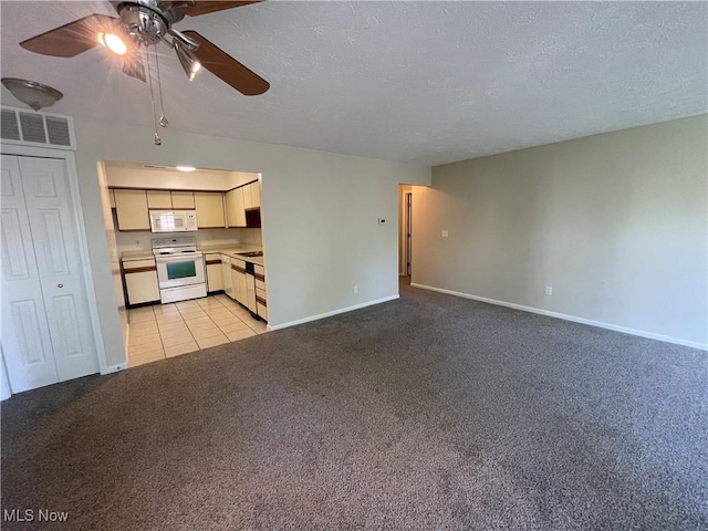 1304 Cedarwood Dr Unit D2, Westlake, OH 44145 - unfurnished living room featuring ceiling fan, light carpet, a textured ceiling, and light tile patterned floors