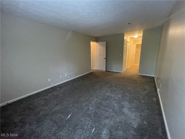 1304 Cedarwood Dr Unit D2, Westlake, OH 44145 - carpeted spare room featuring baseboards and a textured ceiling