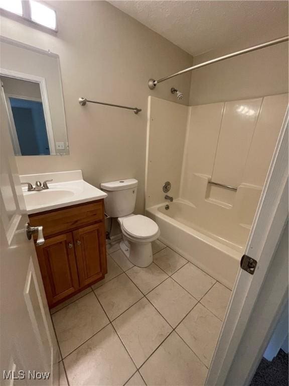 1304 Cedarwood Dr Unit D2, Westlake, OH 44145 - full bath with vanity, tile patterned floors, washtub / shower combination, and a textured ceiling