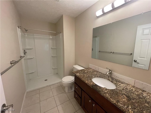 1304 Cedarwood Dr Unit D2, Westlake, OH 44145 - bathroom featuring a textured ceiling, tile patterned floors, vanity, and a shower