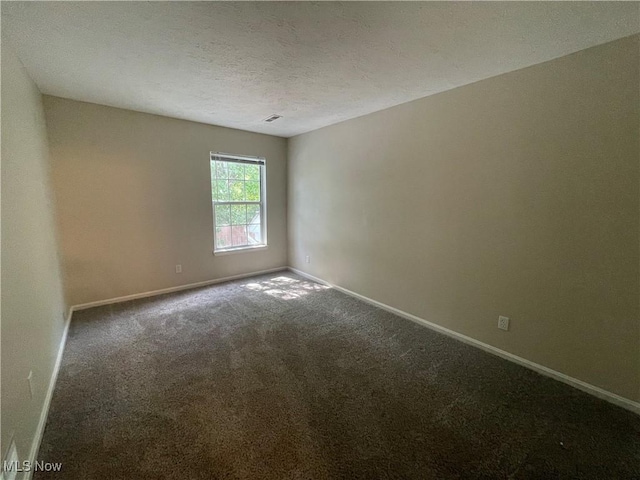 1304 Cedarwood Dr Unit D2, Westlake, OH 44145 - carpeted empty room featuring baseboards and a textured ceiling