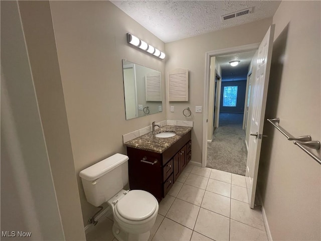 1304 Cedarwood Dr Unit D2, Westlake, OH 44145 - bathroom featuring a textured ceiling, vanity, and tile patterned floors