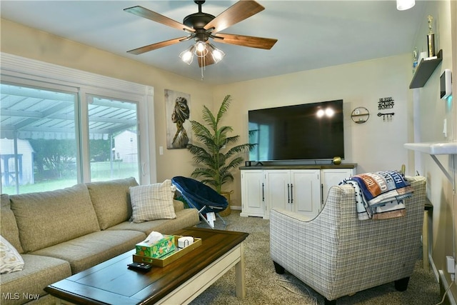 3992 Allenwood Dr SE, Warren, OH 44484 - carpeted living room featuring a ceiling fan and baseboards