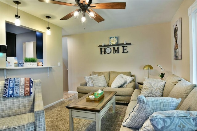 3992 Allenwood Dr SE, Warren, OH 44484 - living room featuring ceiling fan and carpet flooring