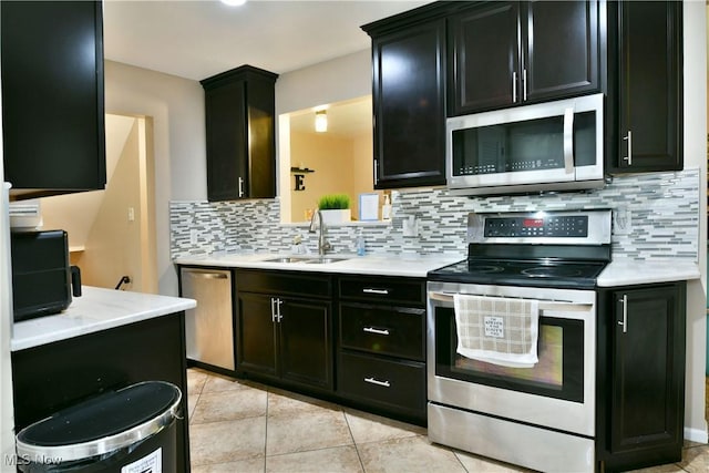 3992 Allenwood Dr SE, Warren, OH 44484 - kitchen featuring stainless steel appliances, light countertops, and dark cabinetry