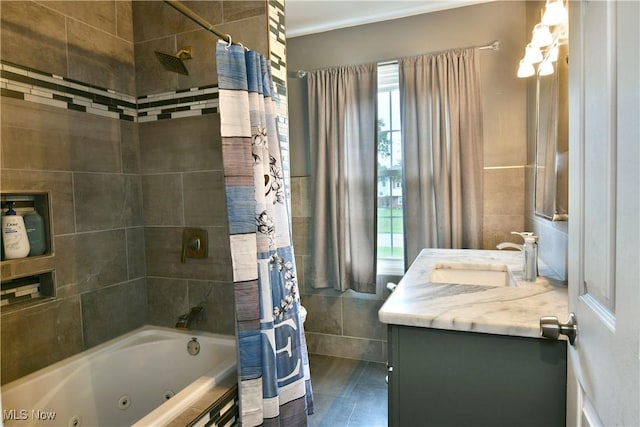 3992 Allenwood Dr SE, Warren, OH 44484 - full bathroom featuring tile walls, vanity, and a combined bath / shower with jetted tub