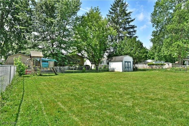 3992 Allenwood Dr SE, Warren, OH 44484 - fenced backyard featuring a playground and a shed