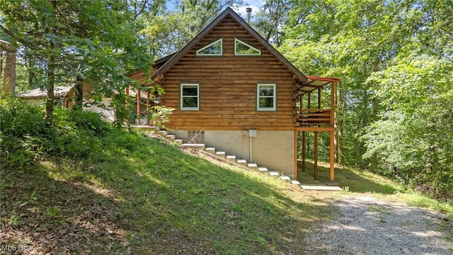 30101 Friendly Ridge Rd, Freeport, OH 43973 - view of property exterior with log exterior and a wooden deck