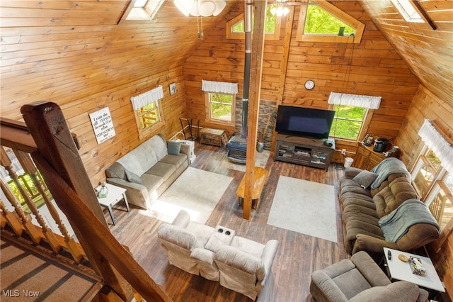 30101 Friendly Ridge Rd, Freeport, OH 43973 - living area featuring a skylight, lofted ceiling, wooden walls, plenty of natural light, and hardwood / wood-style flooring