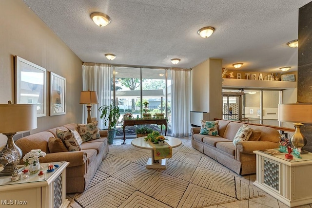 25801 Lake Shore Blvd Unit 28, Euclid, OH 44132 - living room featuring a textured ceiling and floor to ceiling windows