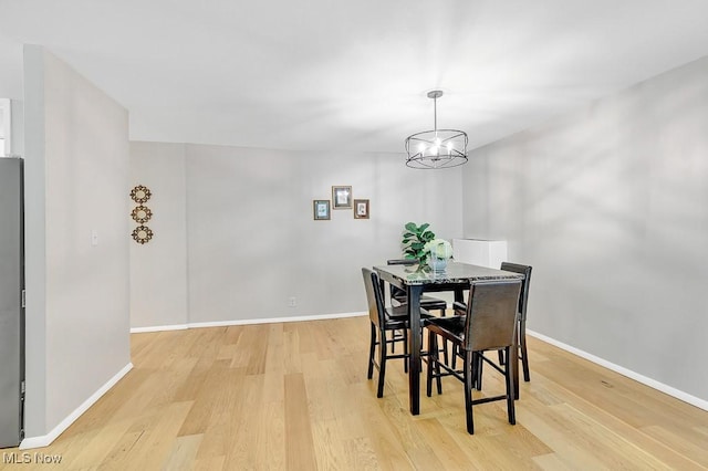25801 Lake Shore Blvd Unit 28, Euclid, OH 44132 - dining space with light wood-type flooring and a chandelier