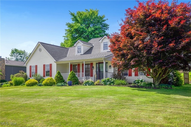 1550 Rebel St SW, Canton, OH 44706 - new england style home with covered porch, a front lawn, and roof with shingles