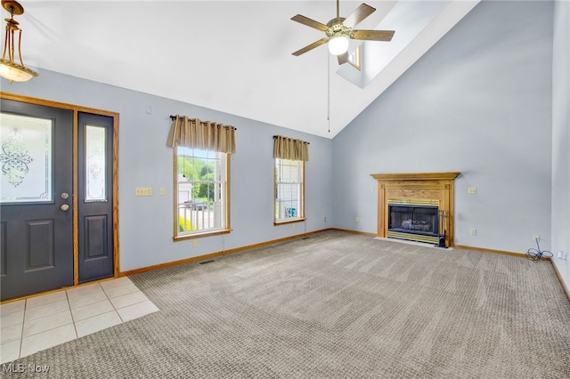 1550 Rebel St SW, Canton, OH 44706 - carpeted foyer entrance featuring ceiling fan, high vaulted ceiling, and a fireplace with flush hearth