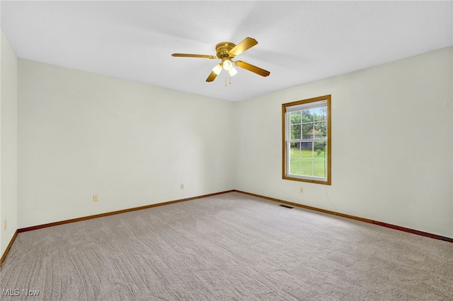 1550 Rebel St SW, Canton, OH 44706 - spare room with carpet flooring and a ceiling fan