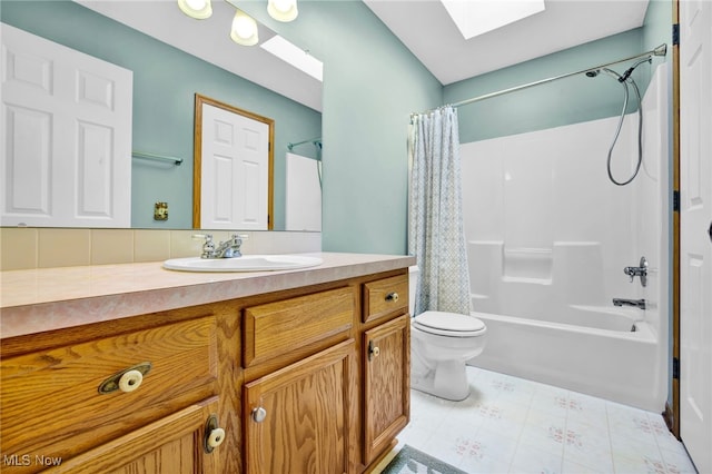 1550 Rebel St SW, Canton, OH 44706 - bathroom featuring a skylight, vanity, and shower / bath combo with shower curtain