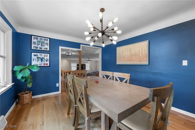 6190 Fitch Rd, North Olmsted, OH 44070 - dining room featuring a chandelier and wood-type flooring