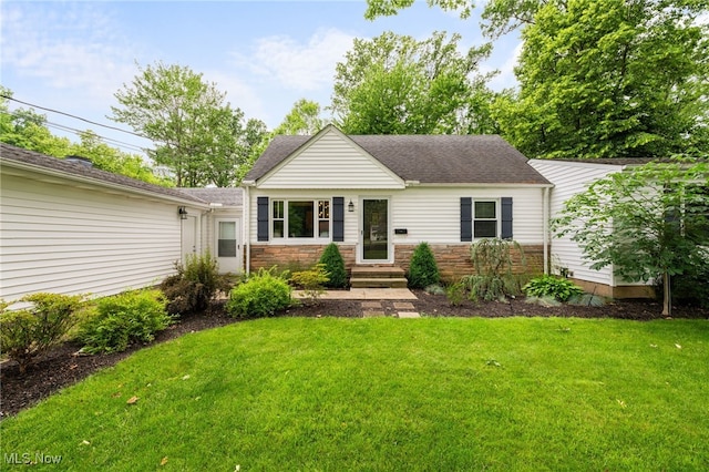 6190 Fitch Rd, North Olmsted, OH 44070 - view of front of property with a front lawn, entry steps, stone siding, and a shingled roof
