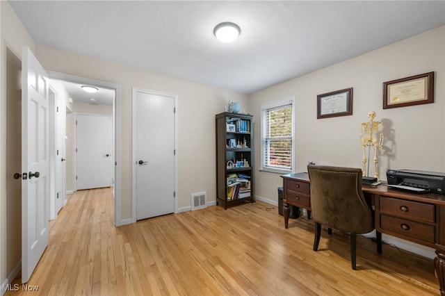 6190 Fitch Rd, North Olmsted, OH 44070 - home office featuring light wood-type flooring and baseboards