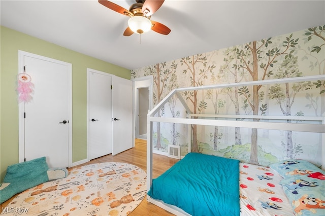 6190 Fitch Rd, North Olmsted, OH 44070 - bedroom featuring wallpapered walls, light wood-type flooring, and ceiling fan