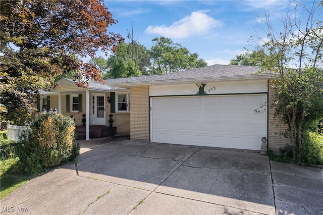 578 25th St NW, Massillon, OH 44647 - ranch-style home with brick siding, driveway, a garage, and covered porch