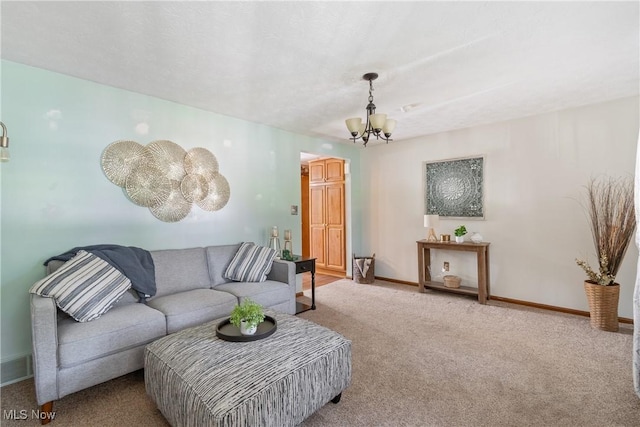 578 25th St NW, Massillon, OH 44647 - living room featuring a chandelier and carpet flooring