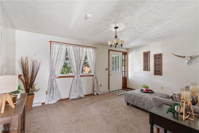 578 25th St NW, Massillon, OH 44647 - carpeted entryway featuring a chandelier and a textured ceiling