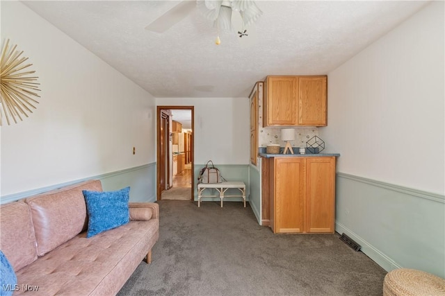 578 25th St NW, Massillon, OH 44647 - carpeted living area featuring a ceiling fan