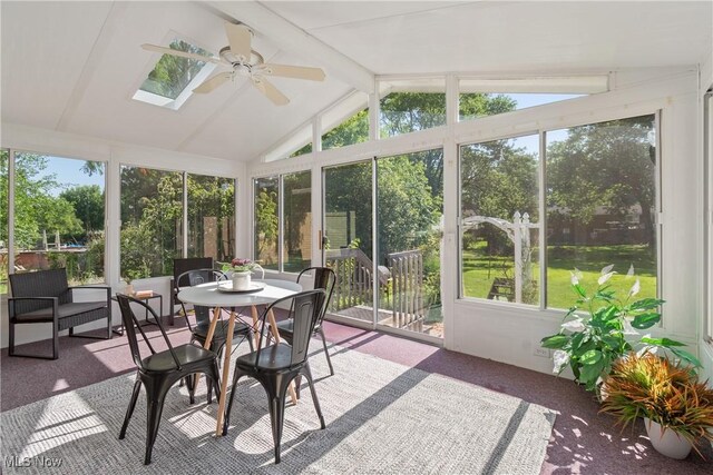 578 25th St NW, Massillon, OH 44647 - sunroom / solarium featuring ceiling fan, a skylight, and outdoor dining space