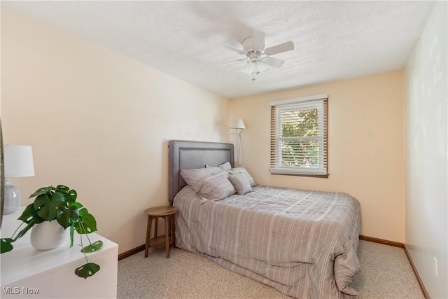 578 25th St NW, Massillon, OH 44647 - carpeted bedroom featuring baseboards and a ceiling fan
