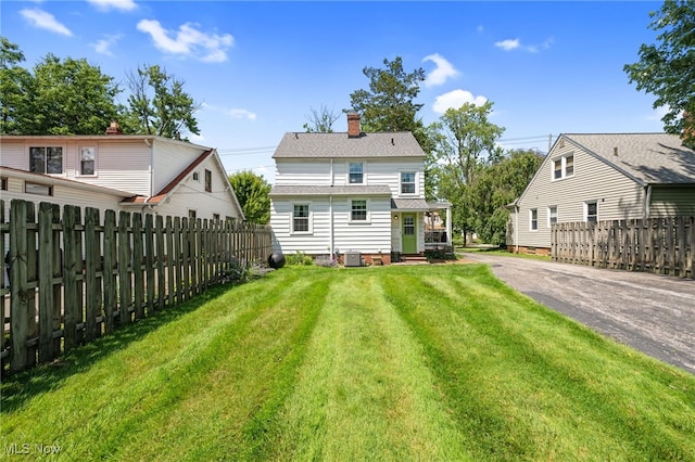 5100 Edenhurst Rd, Lyndhurst, OH 44124 - back of house with driveway and a chimney