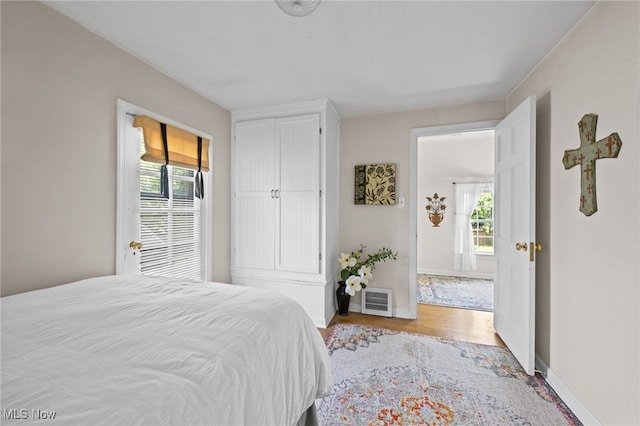 5100 Edenhurst Rd, Lyndhurst, OH 44124 - bedroom with multiple windows and wood finished floors