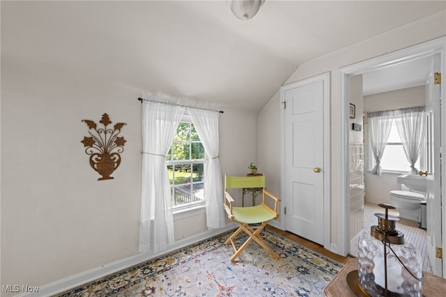 5100 Edenhurst Rd, Lyndhurst, OH 44124 - living area with plenty of natural light, vaulted ceiling, and wood finished floors
