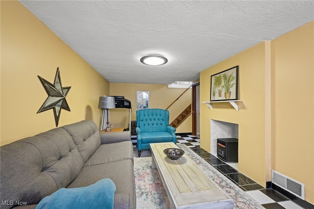 5100 Edenhurst Rd, Lyndhurst, OH 44124 - living area with stairs and a textured ceiling