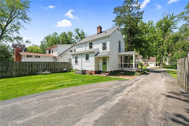 5100 Edenhurst Rd, Lyndhurst, OH 44124 - rear view of property featuring a chimney and a shingled roof