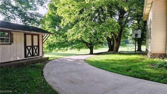 8171 Pheasant Ave NW, North Canton, OH 44720 - view of green lawn featuring a storage shed
