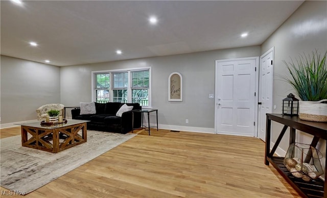 8171 Pheasant Ave NW, North Canton, OH 44720 - living room with recessed lighting and light wood-style flooring