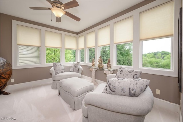 8309 Gentry St NW, Massillon, OH 44646 - living area featuring healthy amount of natural light, ceiling fan, and carpet floors