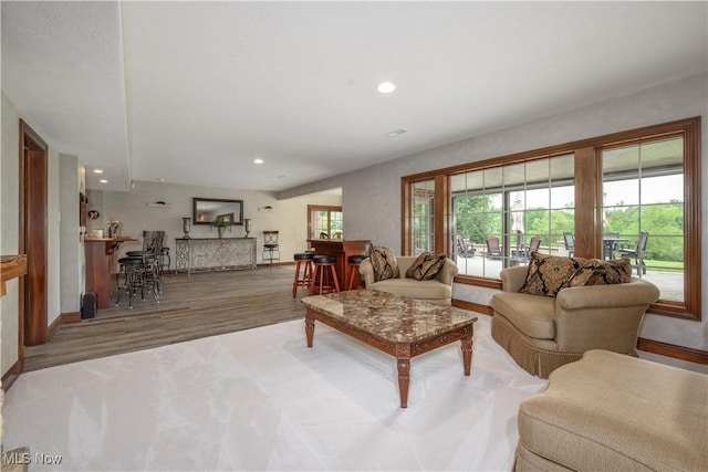8309 Gentry St NW, Massillon, OH 44646 - living area featuring wood finished floors, plenty of natural light, and recessed lighting