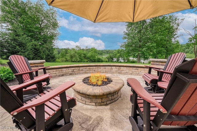 8309 Gentry St NW, Massillon, OH 44646 - view of patio with an outdoor fire pit