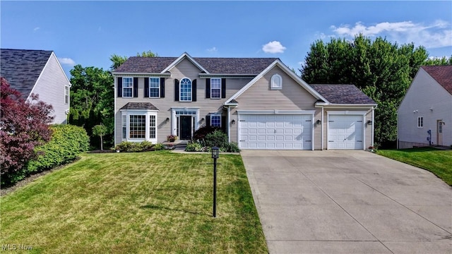 2720 Pinegate Dr, Norton, OH 44203 - colonial-style house featuring a front yard, an attached garage, and driveway