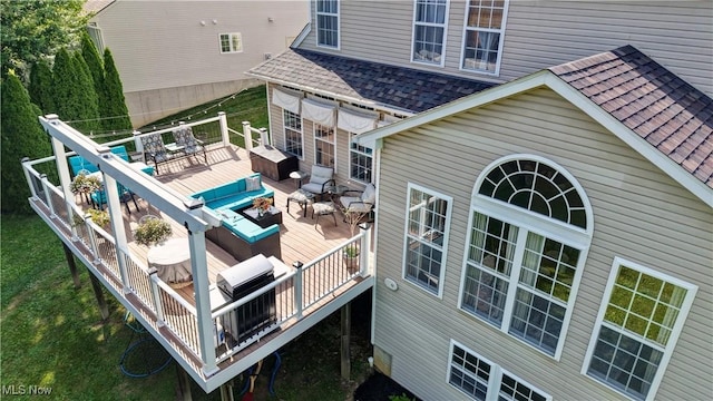 2720 Pinegate Dr, Norton, OH 44203 - back of house featuring a deck, roof with shingles, an outdoor hangout area, and outdoor dining space
